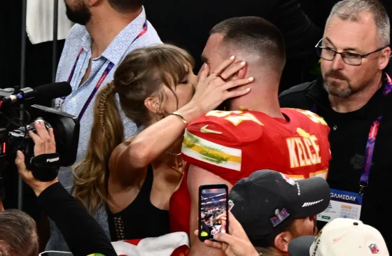 Taylor Swift and Travis Kelce share a moment on the field following the Chiefs Super Bowl win.Patrick T. Fallon / AFP - Getty Images